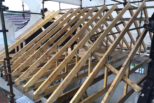 Wooden beams in place on roof of house. Case study Fire Damaged Roof Repair Paisley