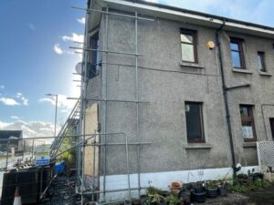 Side of house with scaffold and boarded up window. emergency make-safe blog