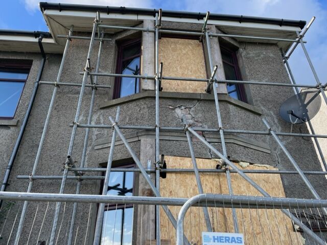 Front of house with scaffold and boarded up windows. emergency make-safe blog